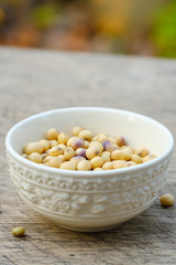 Soy bean in bowl on  wooden floor