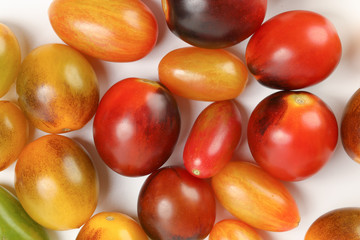 Fresh ripe mixed tomato verity assorted color on white background