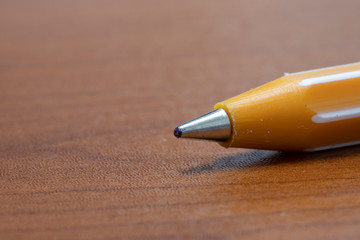 Red gloves and yellow scouring pad. Foam dripping while squeezing the sponge. Close up.