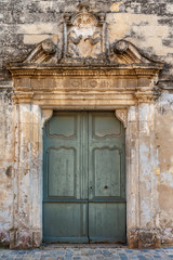 Weathered doorway in old stone wall