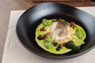 Cod fillet baked with avocado puree and israeli ptitim