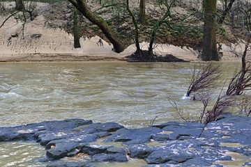swifly flowing water over rocks