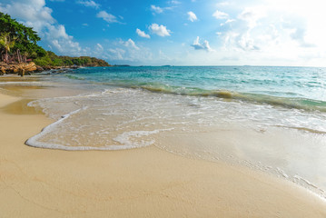 Sea waves on sand beach water and coast seascape - View of beautiful tropical landscape beach sea island with ocean blue sky and resort background in Thailand summer beach vacation