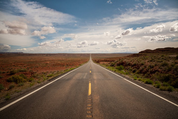 The road behind Monument Valley on the Utah/Arizona border in the United States of America. Summer road trip through the USA. 
