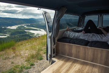 Van life, travel on a  beautiful, warm summer day in Dawson City, northern Yukon Territory, Canada. 