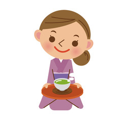 お客様にお茶を出す旅館の女将さん