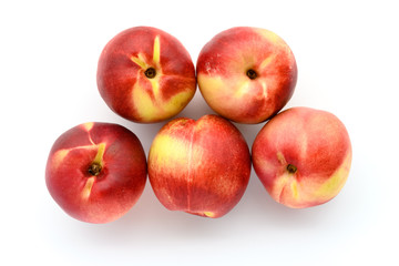 top view fresh peaches on a white background