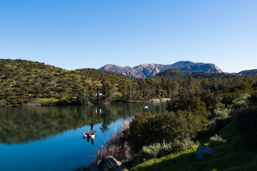 People fish from boats at Lake Jennings in Lakeside, California located in San Diego County also a popular destination for hiking, camping and picnicking.