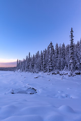 Fototapeta na wymiar Winter wonderland at Upper Kananaskis Lake in Alberta, Canada