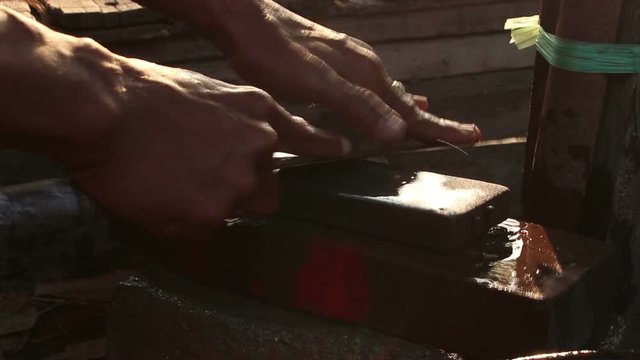Man hands Sharpening knife