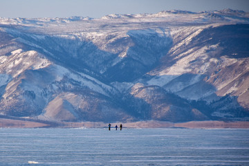 Landscape with people on frozen Lake Baikal Siberia Russia