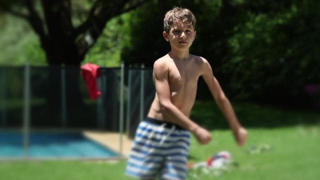 Child boy dancing the floss dance outdoors