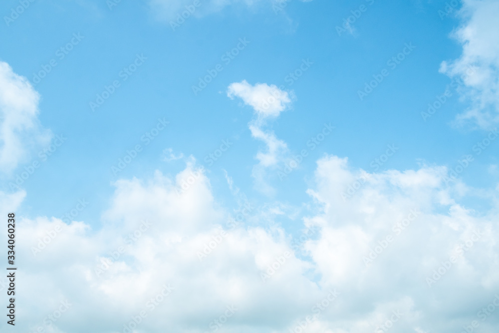 Wall mural cloudy blue sky background