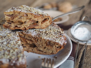 Yeast homemade fruit cake. Pie on a wooden table.
