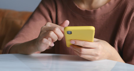 Close up of woman use of mobile phone at home