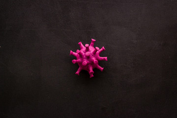 Abstract Corona virus Covid-19 strain model on black background top-down copy space