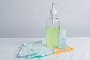 Coronavirus prevention medical surgical masks and hand sanitizer gel for hand hygiene corona virus protection.
