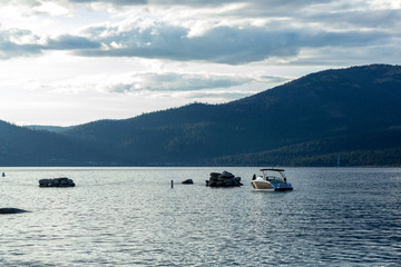 Boats anchored near a beach in lake tahoe