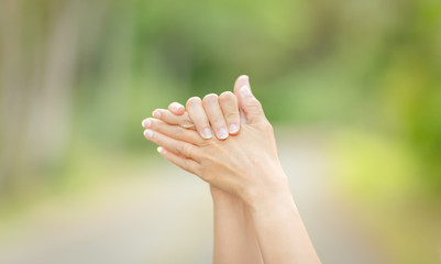 he hands of Asian women are washing their hands using disinfecting alcohol. Everyday life