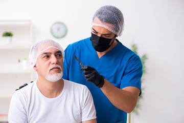 Old man visiting male doctor for plastic surgery