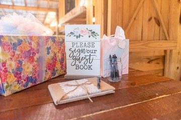 Closeup shot of event objects on the table with a white panel entitled 