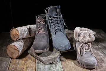 Different Shoes On Wooden Table