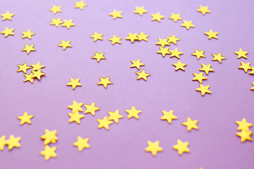Golden stars glitter on pink background. 