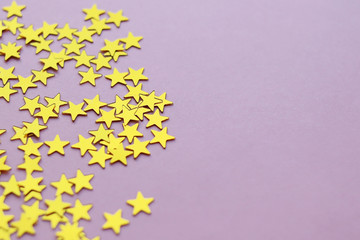 Golden stars glitter on pink background. 