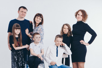 concept of happy childhood, family, love - group of people on a white background: adults and children