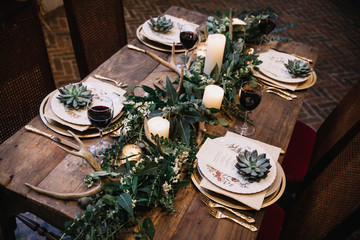 A table scape designed for an intimate boho style event with rustic touches. View from above