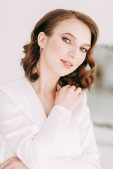 Fototapeta premium Stylish European wedding. Modern trends in the image of the bride. Bright portrait of the bride in the interior Studio.