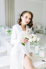  Stylish European wedding. Modern trends in the image of the bride. Bright portrait of the bride in the interior Studio.