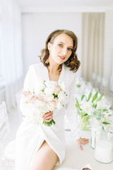  Stylish European wedding. Modern trends in the image of the bride. Bright portrait of the bride in the interior Studio.