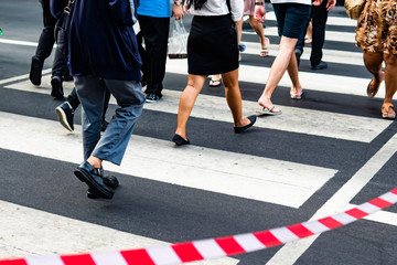 Crowd crossing the pedestrian crossing