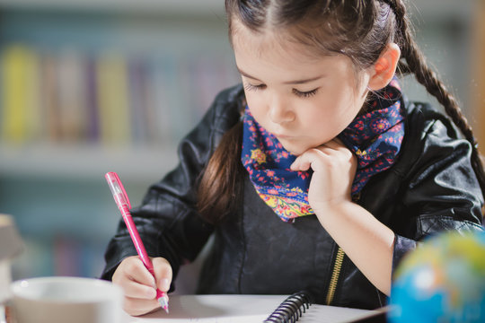 foreigner girl learning,playing in the library with happy.