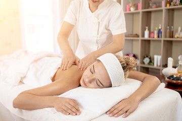 Obraz na płótnie Canvas Woman Relaxes in the Spa Body massage Treatment.