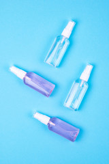 Top view of antibacterial antiseptic spray for hands sanitizer on blue background.Prevention against virus, bacteria or coronavirus.