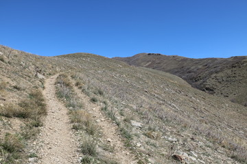 Arid landscape of Wasatch mountain foothills at Mt Van Cott trail in early spring, Salt Lake City, Utah, USA