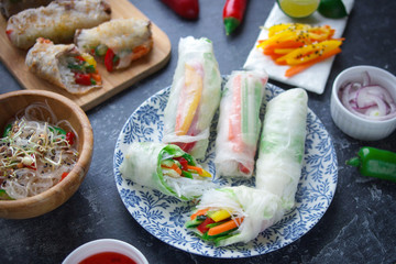 Rice paper rolls with vegetables on a dark background, Vietnamese cuisine, Spring rolls, Asian food