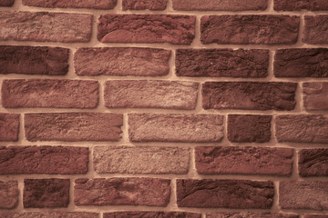 Brick wall made of textured decorative brick.