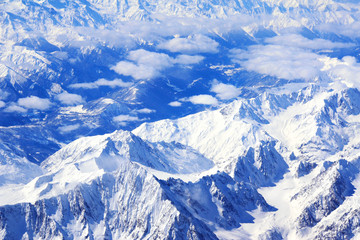 Fototapeta na wymiar Aerial view from the aircraft to Caucasus Mountains covered with snow