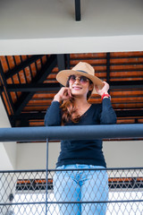 Asian woman with sunglasses on tower