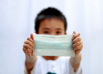 Asian boys with mask protection, COVID-19 or Virus protection concept 