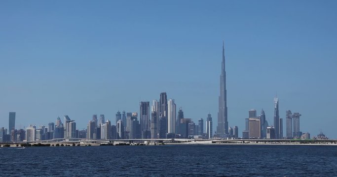 Dubai skyline at daytime with the sea in front. Still shot. 4k.
