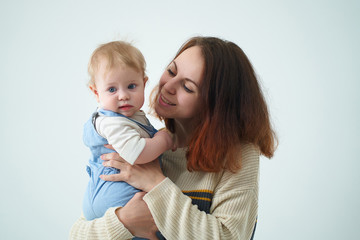 mom holds with her baby in her arms
