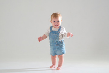 10 month old little baby learning to walk..Studio photography