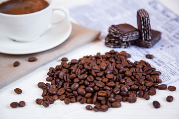 A bunch of coffee beans and some waffles