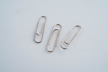 Paper clip on the white background ,Red steel clip