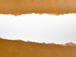 Rip brown paper and white background with space for text.