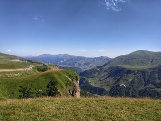 Naklejka premium Paragliding over the canyon